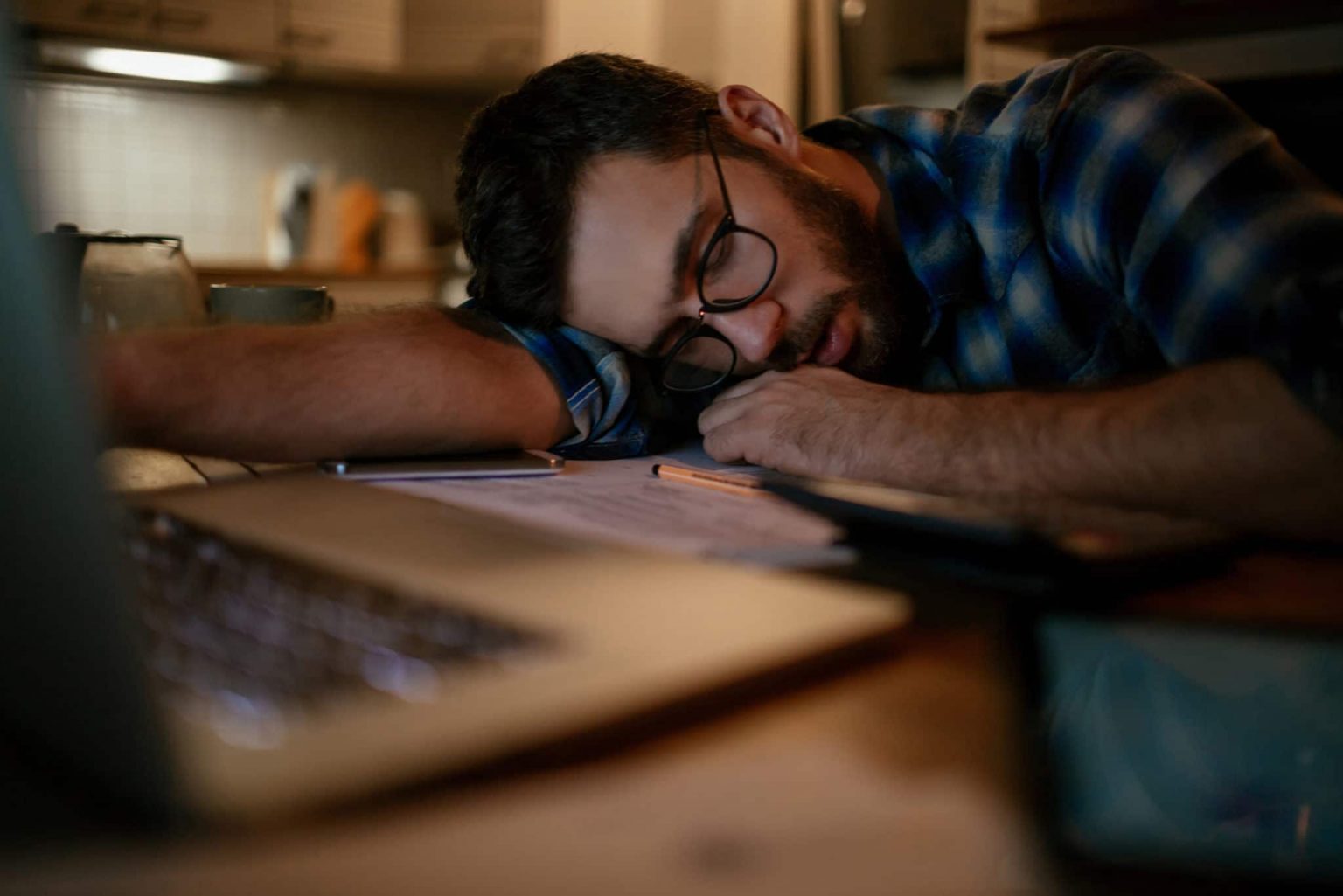 Sleep-Narcolepsy A man asleep at desk experiencing narcolepsy.